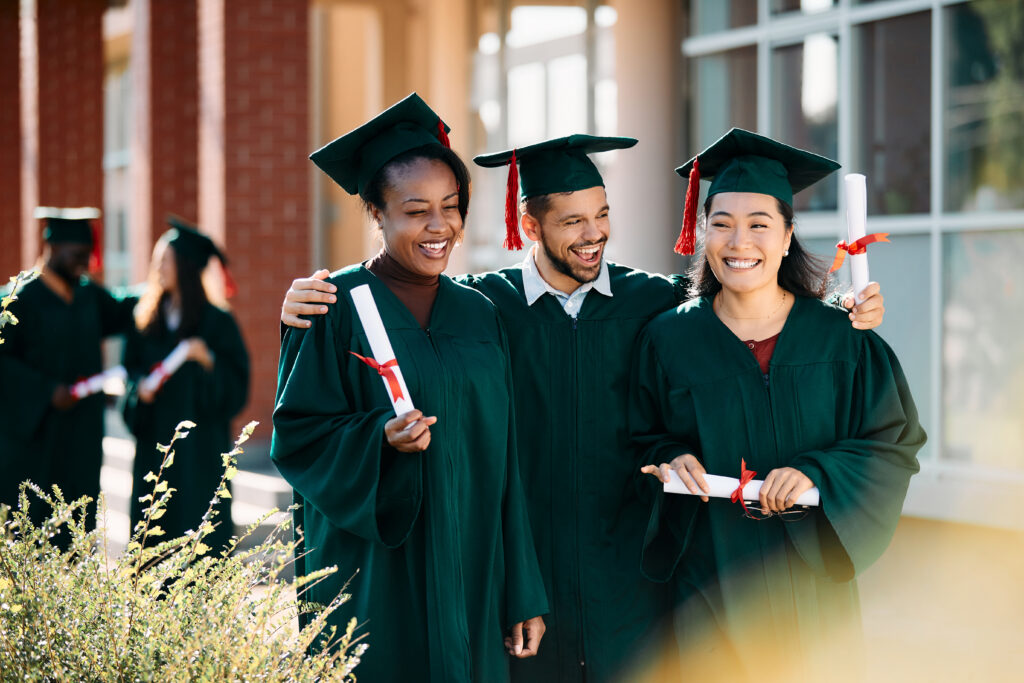 Happy new grads celebrating on their graduation day.