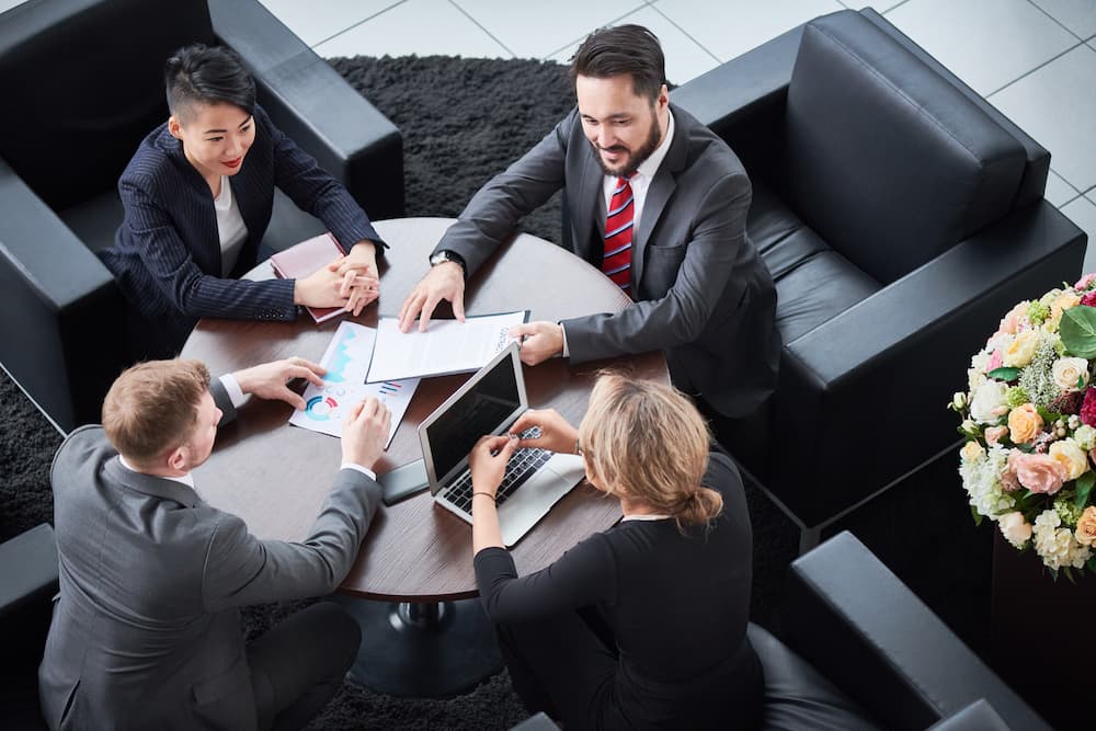 A sales team discussing about sales and marketing solutions.